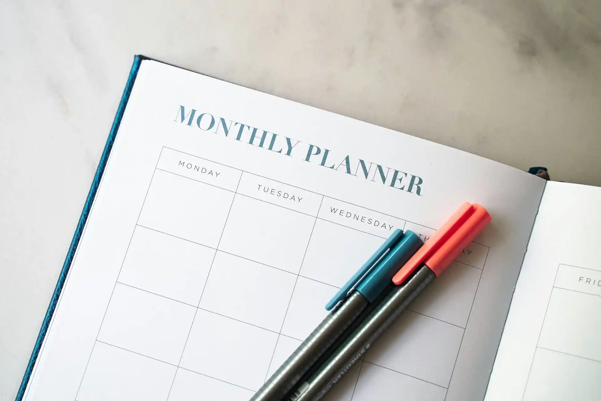 Monthly Planner with two different colored pens